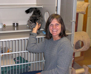 Photo of a woman and a cat.